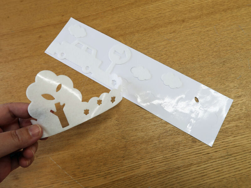 Removing decorative punch-out pieces from a KOKUBO condensation absorbing sheet