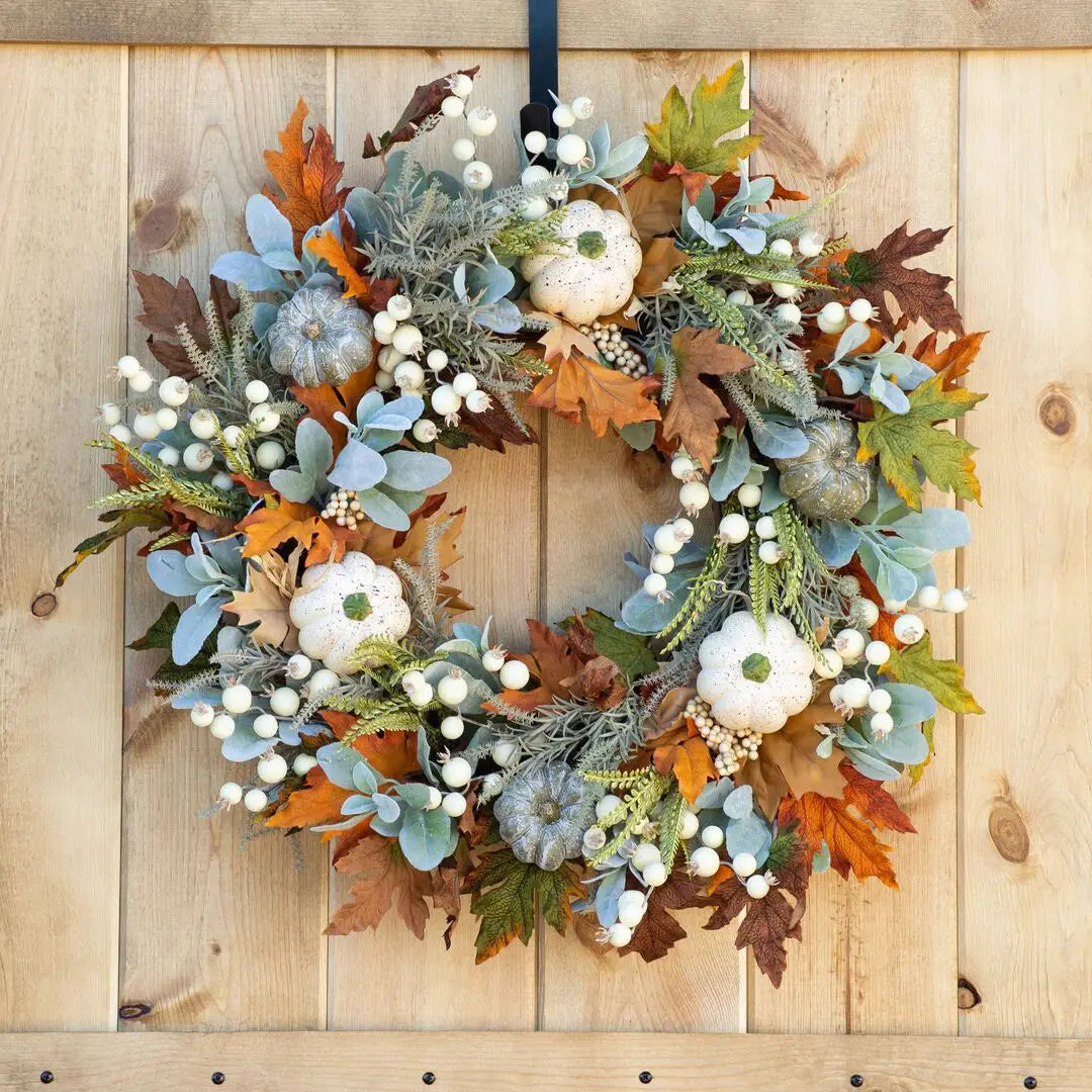 white pumpkin autumn wreath with foliage and berries