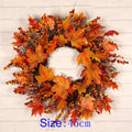 white pumpkin autumn wreath with foliage and berries