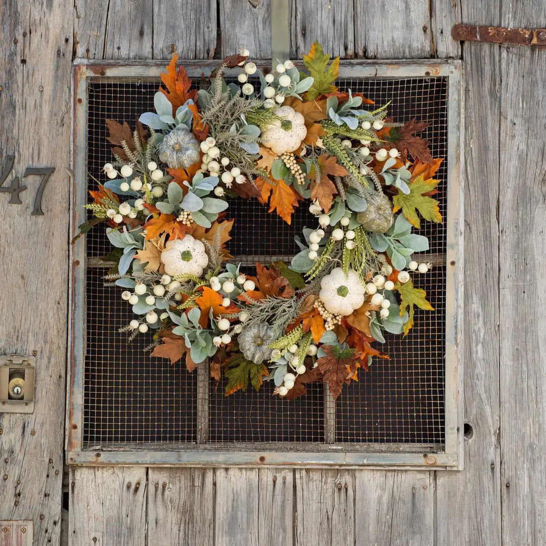 white pumpkin autumn wreath with foliage and berries