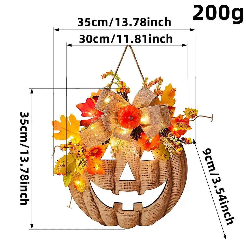 light up autumn pumpkin door hanger with maple leaves and bow