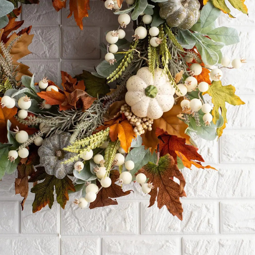 white pumpkin autumn wreath with foliage and berries