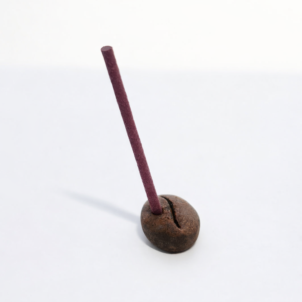 Small COFFEE STONE incense holder shown with a stick of incense