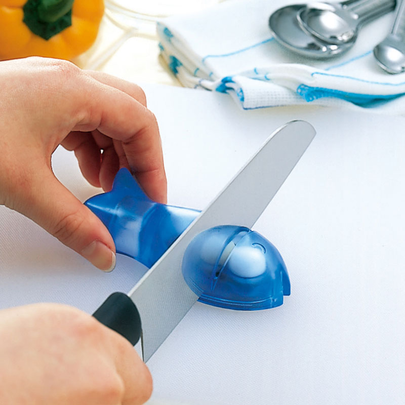 Marna fish-shaped sharpener used to touch up a kitchen knife