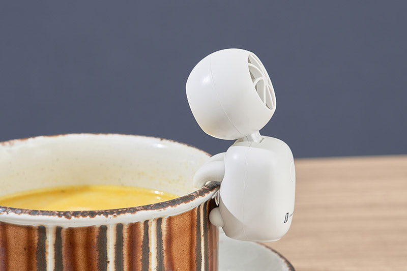 Adjustable fan angle aimed down towards a cup